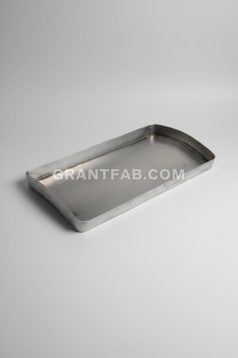 Metal tray on a reflective metal surface