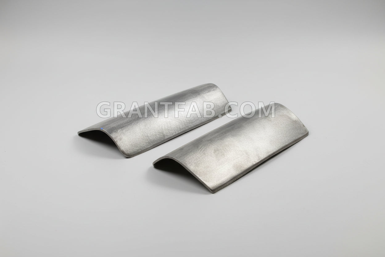 A pair of sheetmetal taillight fillers for a Chevy Astro Van.