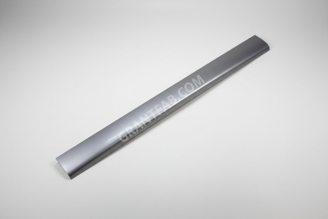 A silver-colored metal roll pan for a Ford vehicle, displaying a smooth, solid surface with a slight curve at one end.