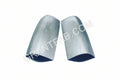 A pair of handmade steel taillight fillers for a Chevy vehicle.