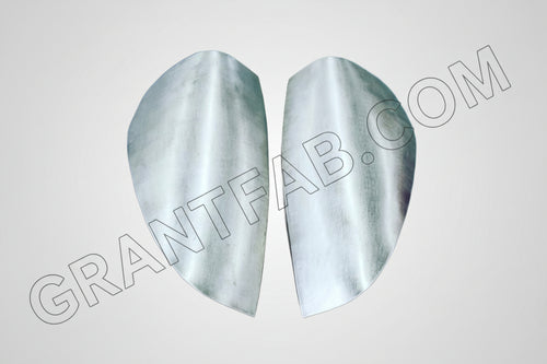 A pair of silver sheetmetal taillight fillers for a Chevy Colorado vehicle.