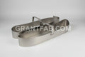 A pair of silver sheet metal taillight buckets for a Toyota Supra tail lights
