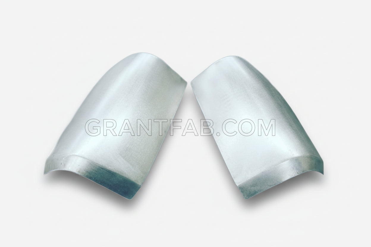 A pair of silver-colored metal taillight fillers for 86-93 Mazda B-Series vehicles.