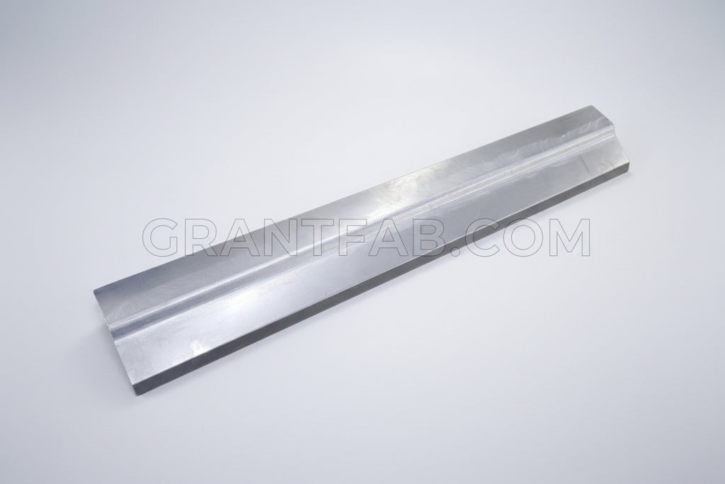 A silver-colored rollpan made from sheet metal, designed for a Dodge D-50 or Mighty Max vehicle.
