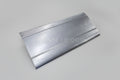 A silver-colored metal auto part, likely a sheet metal piece, with folds and seams indicating it is a component for a vehicle such as a Chevy S-10.