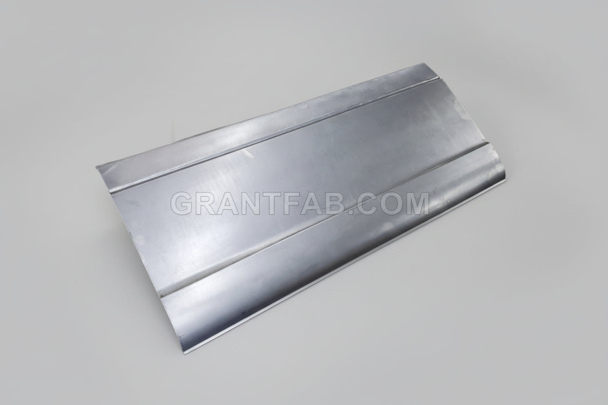 A silver-colored metal auto part, likely a sheet metal piece, with folds and seams indicating it is a component for a vehicle such as a Chevy S-10.