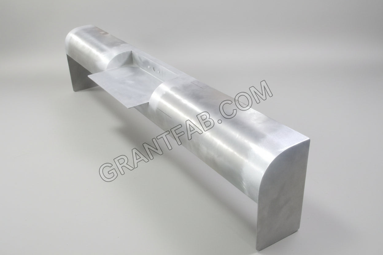 A silver-colored rollpan for a vehicle, made from metal, with a visible seam and weld.
