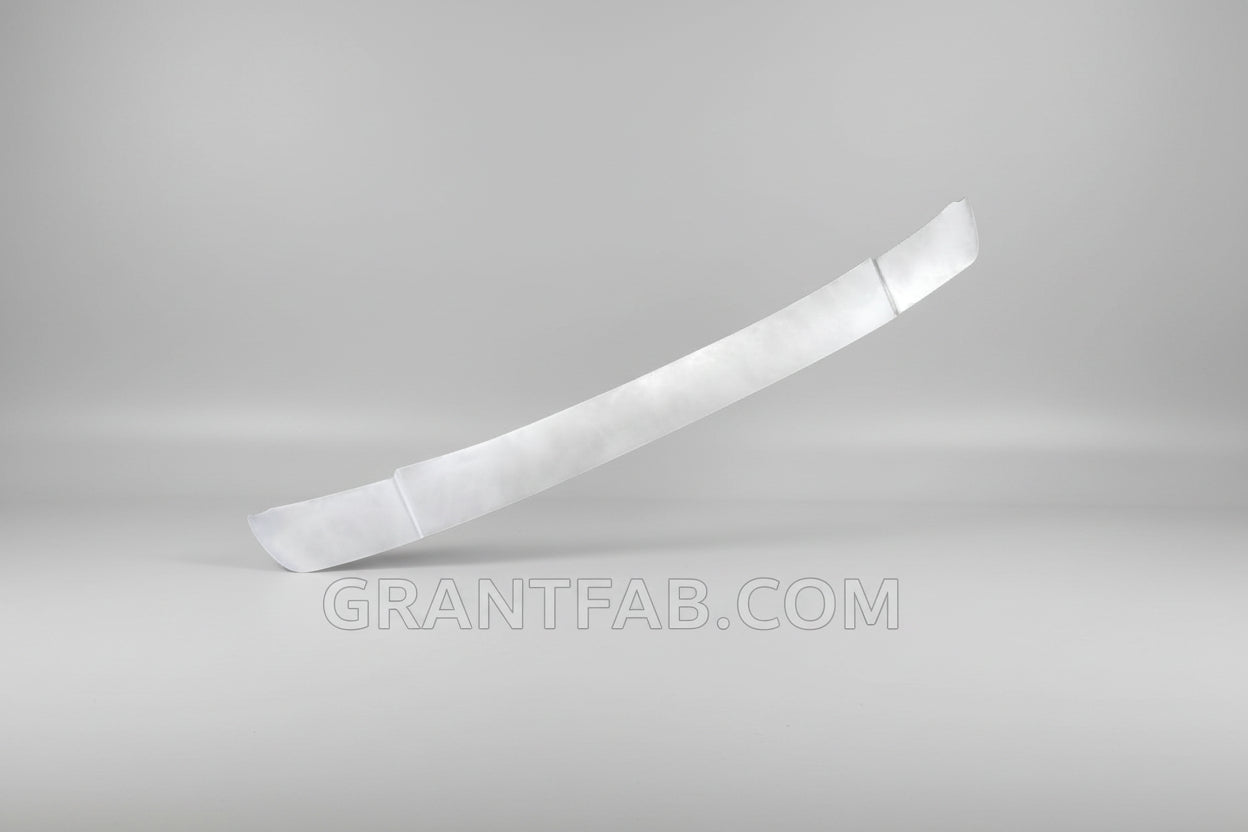 A silver-colored metal wiper cowl filler piece for a Dodge D50/Mighty Max vehicle.