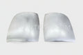 A pair of silver front corner fillers for an Isuzu vehicle.