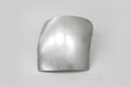 A silver-colored metal corner filler for a Toyota vehicle.
