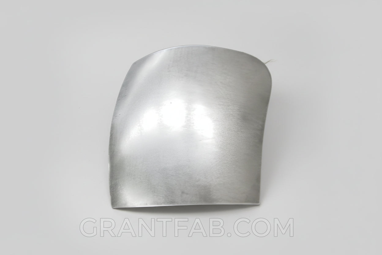A silver-colored metal corner filler for a Toyota vehicle.