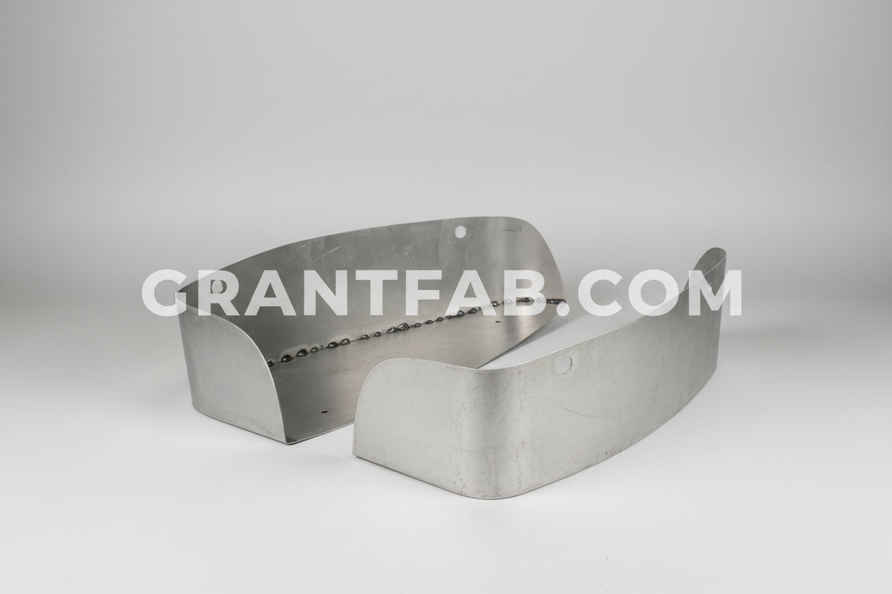A pair of silver metal taillight buckets for a 04-12 Chevy Colorado tail lights.