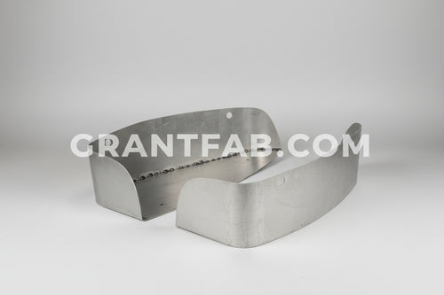 A pair of silver metal taillight buckets for a 04-12 Chevy Colorado tail lights.