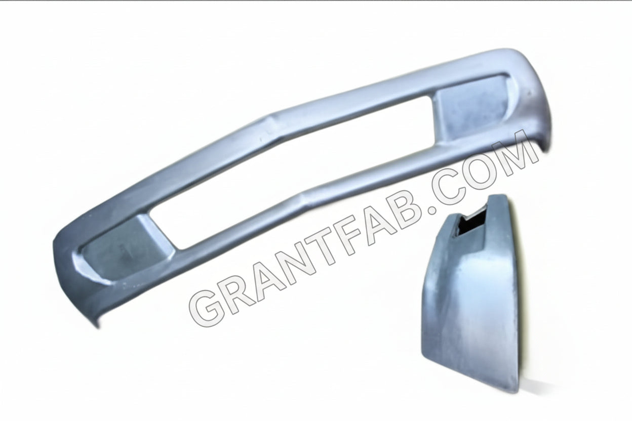Custom silver S-10 truck bumper with scoops and center opening, displayed alongside a separate bumper part.