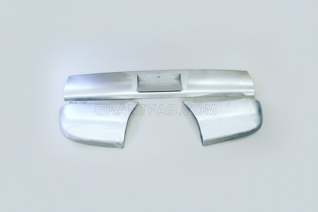 A silver-colored metal roll pan for a Chevy Blazer, featuring a curved shape and weld rear quarters.