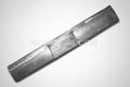 A gray metal rollpan designed for a Nissan Frontier vehicle.