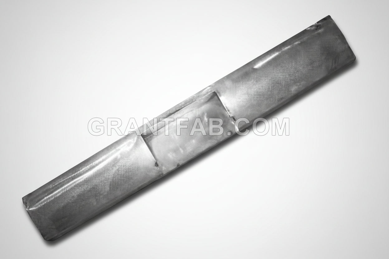 A gray metal rollpan designed for a Nissan Frontier vehicle.