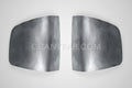 A pair of silver metal taillight fillers for a Chevy S-10 truck.