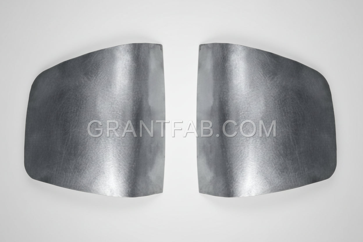 A pair of silver metal taillight fillers for a Chevy S-10 truck.